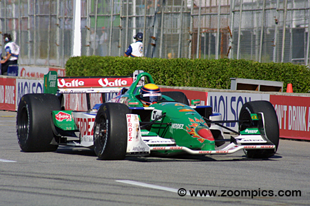 Bruno Junqueira, of Belo Horizonte, Brazil, guides his Ford-Cosworth Lola  for Neman/Haas Racing through the nine turn of the course of the Grand Prix  of Denver with other racers behind him on